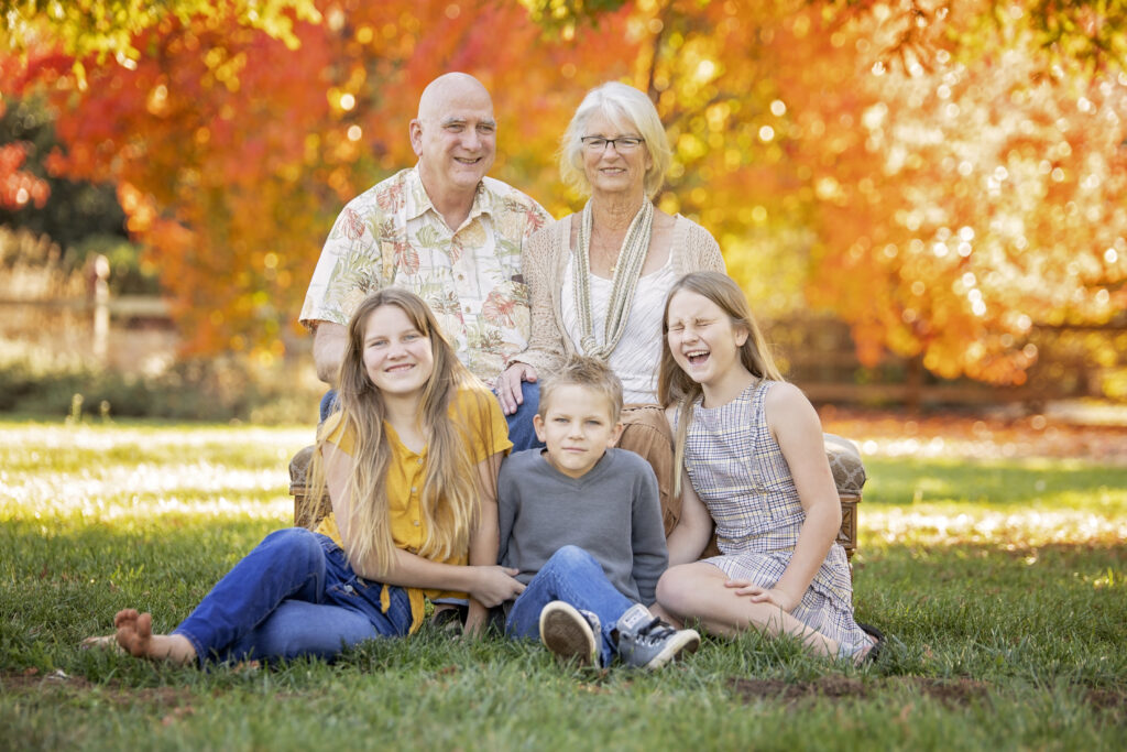 grandparents sitting with grandchildren