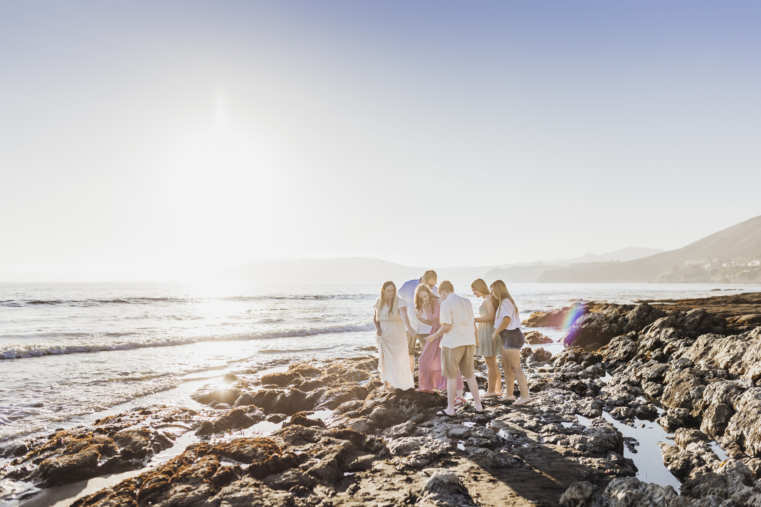 family wih teenagers exploring the tide pools in Shell Beach