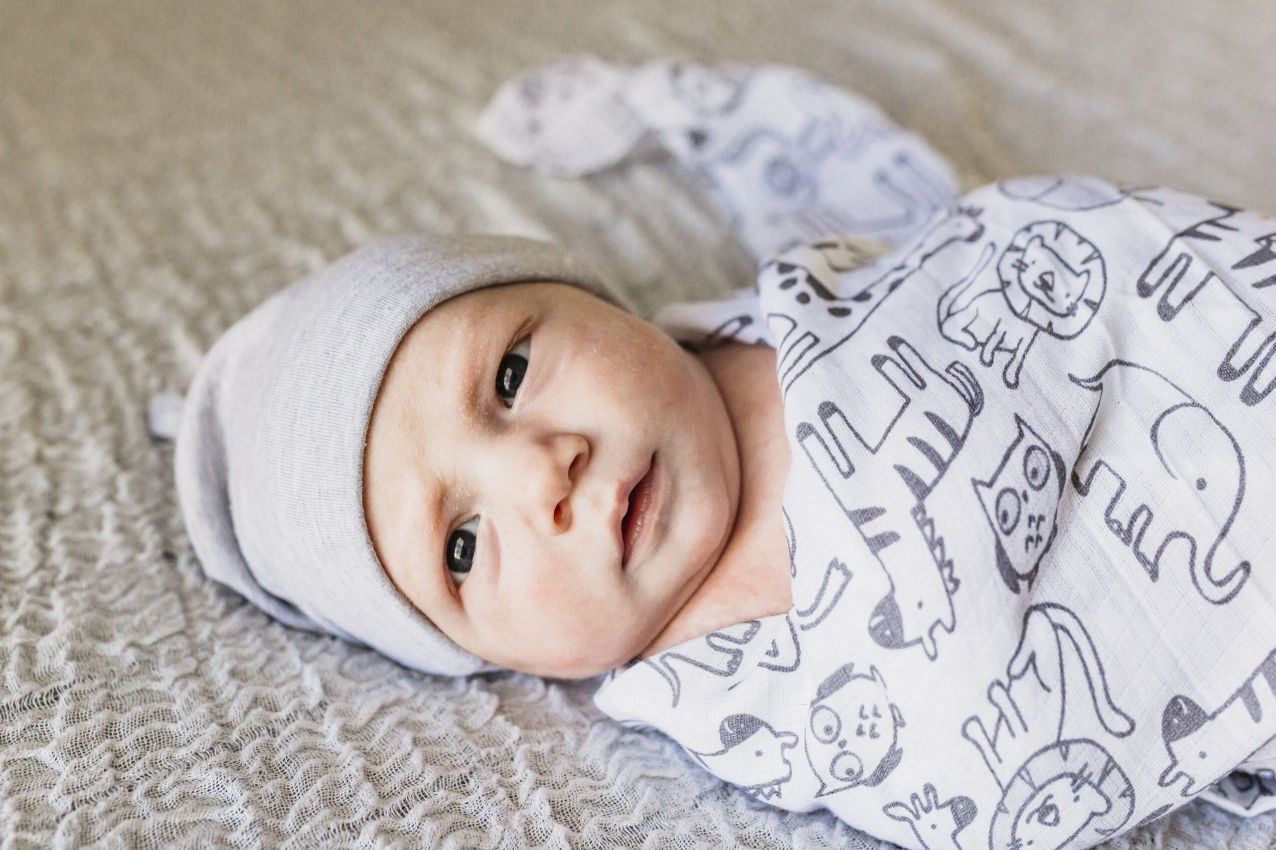 newborn boy with eyes open