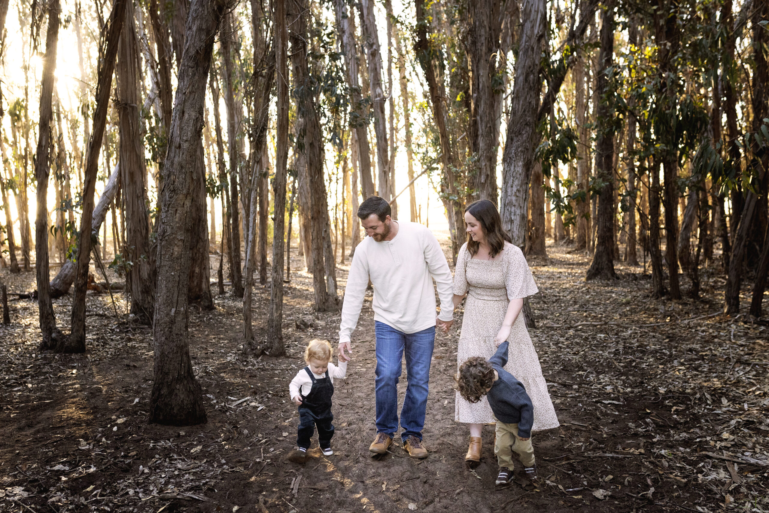 Family of four in a eucalyptus grove