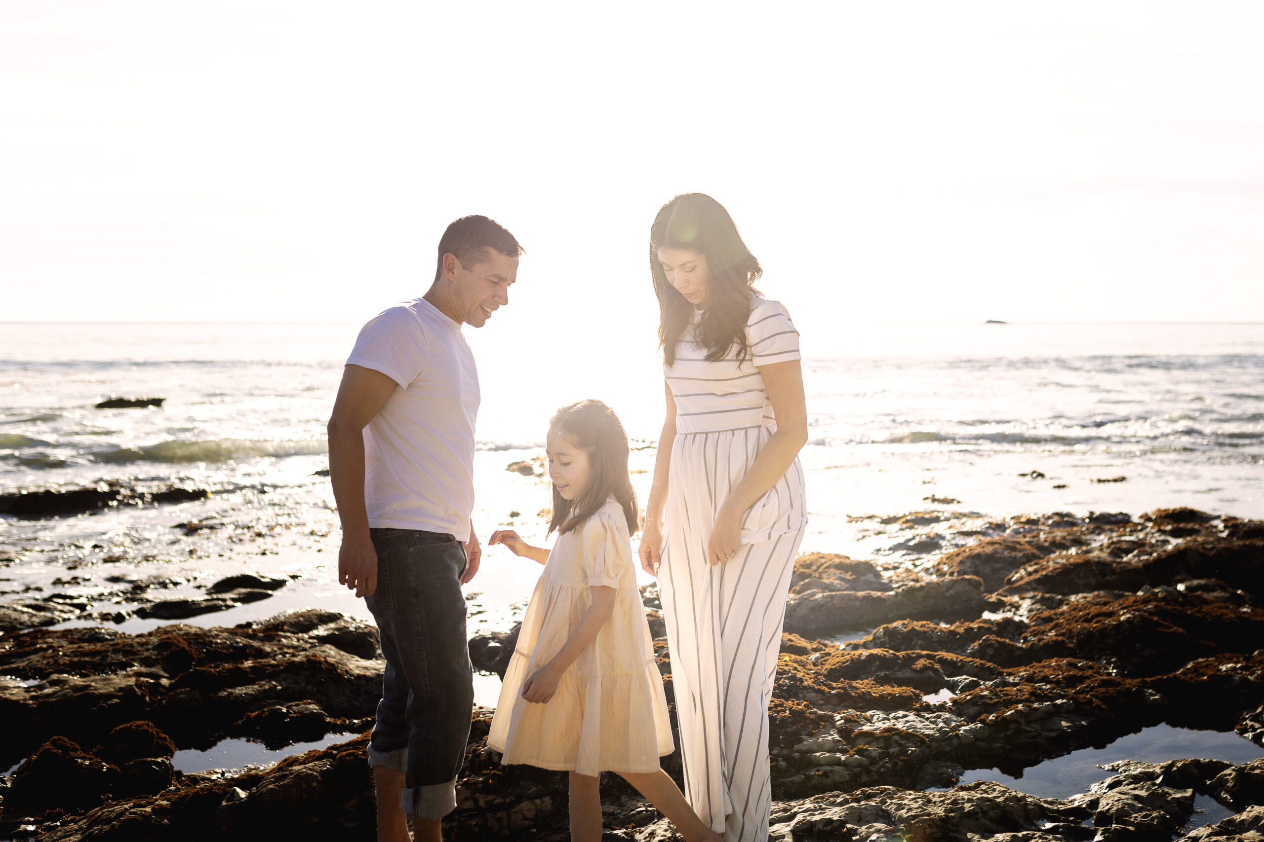 family of three exploring the tidepools at Pismo Beach